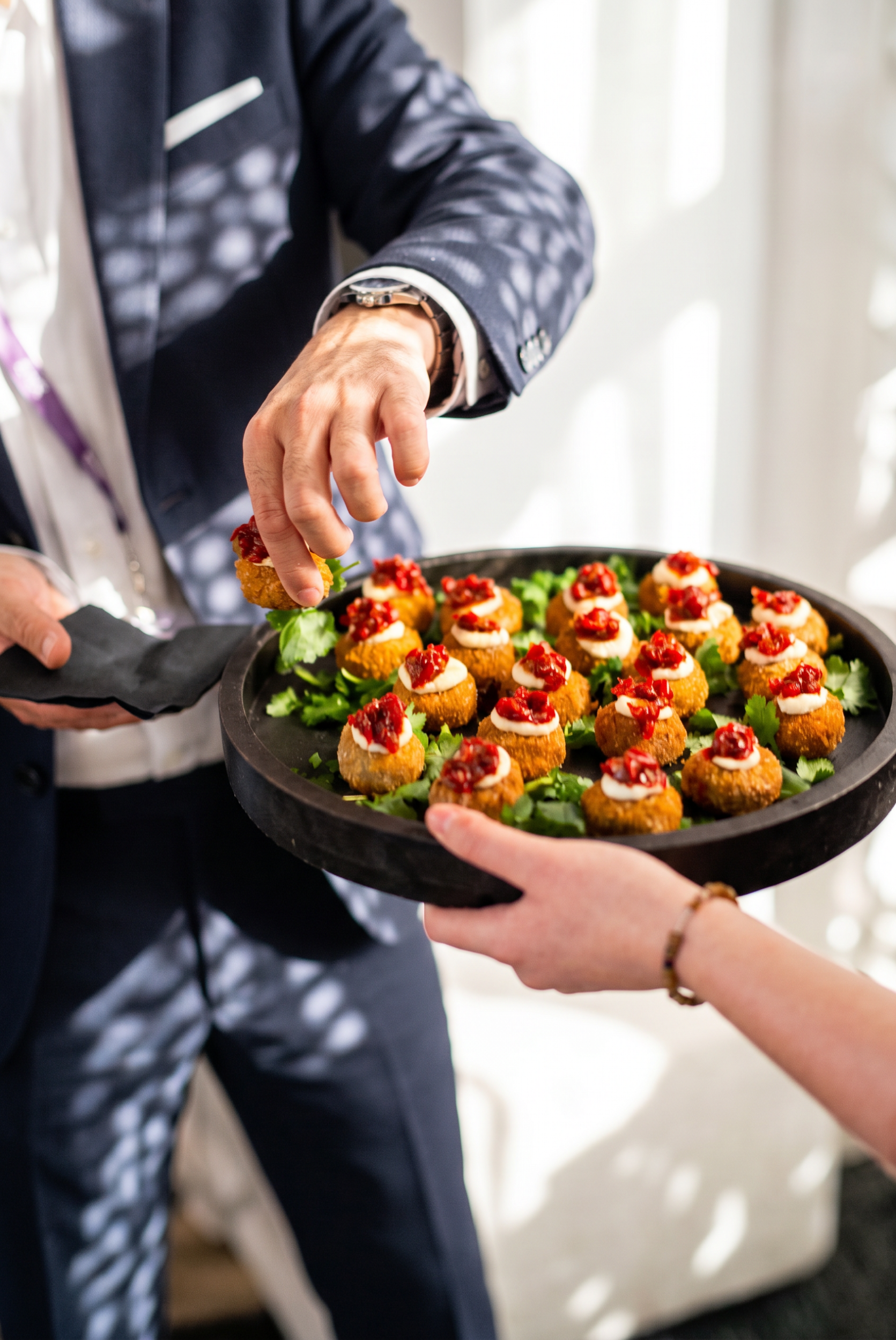 A tray of chef-prepared canapés for a roaming event.