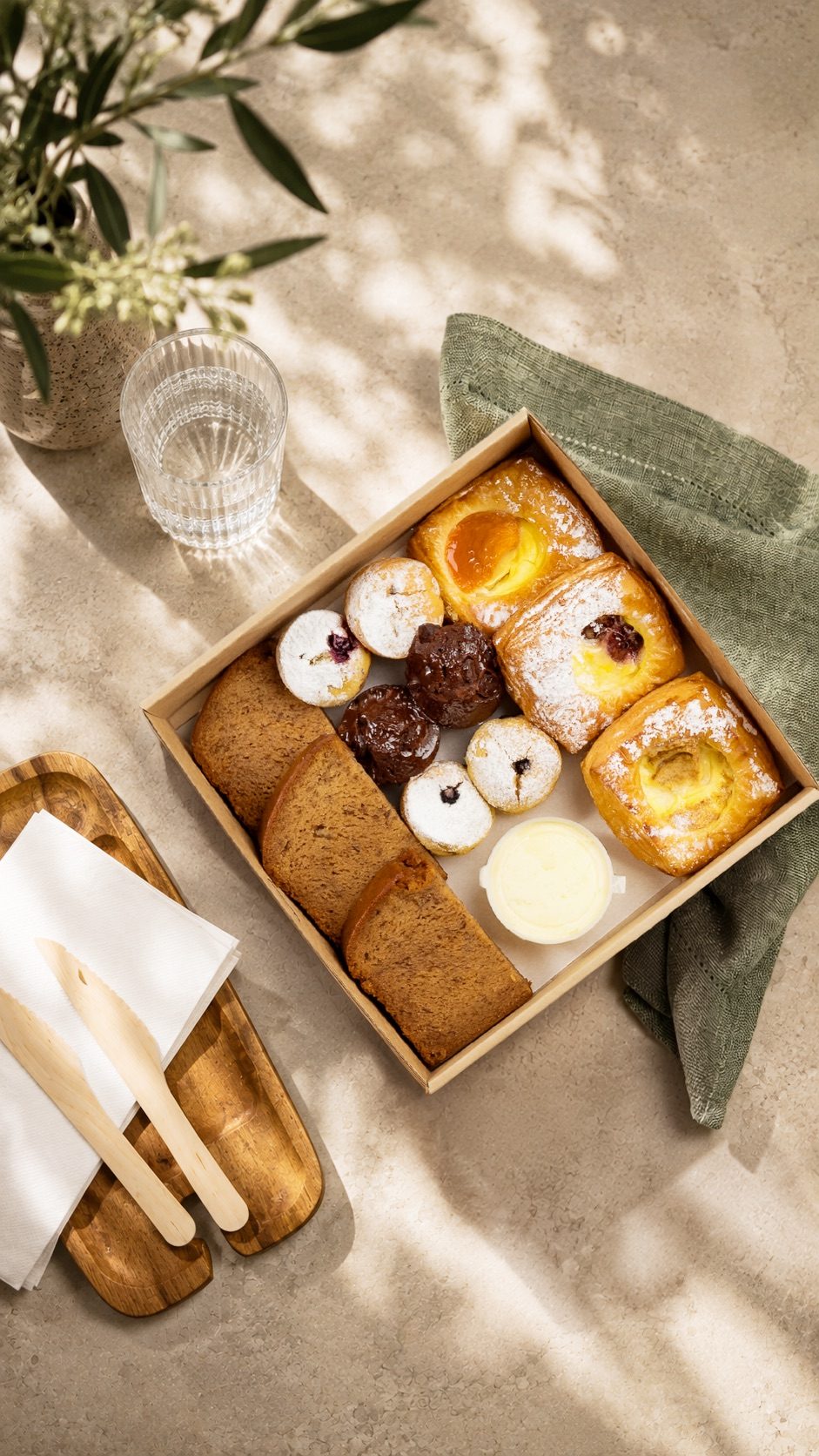 A board of assorted sweet morning tea pieces.